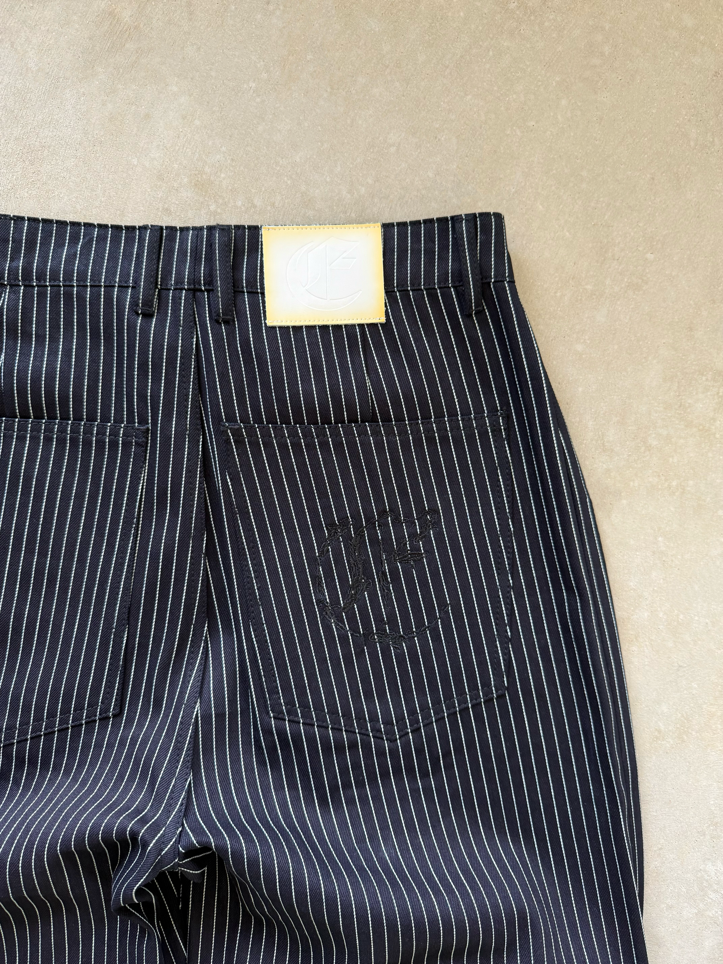 PLEATED PINSTRIPES TROUSERS